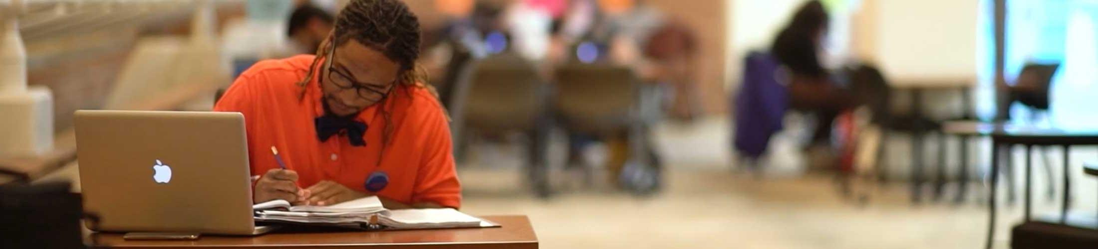 Student studying in academic advising center